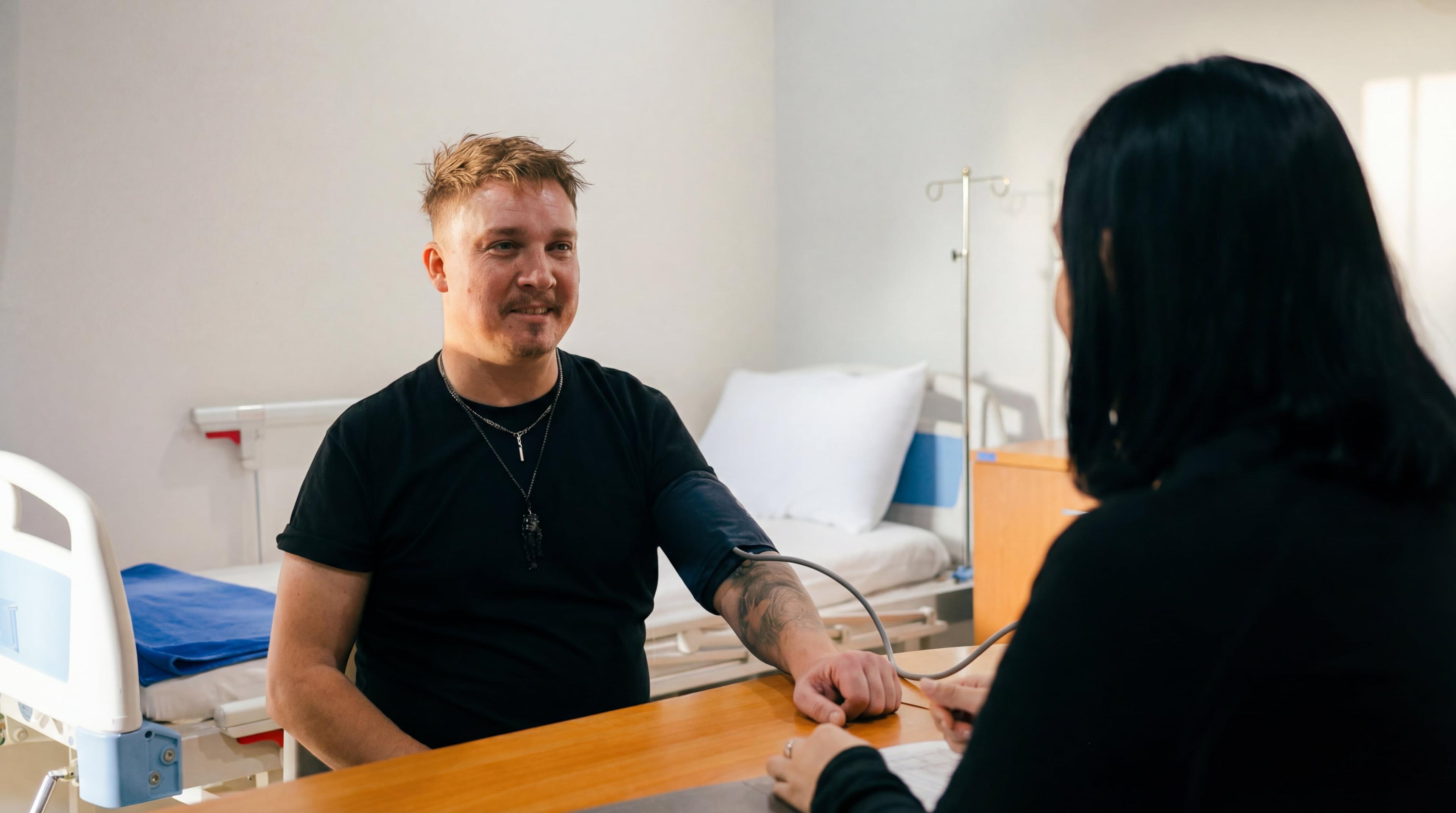 Client receiving blood pressure check during prescription drug assessment at Jintara Rehab