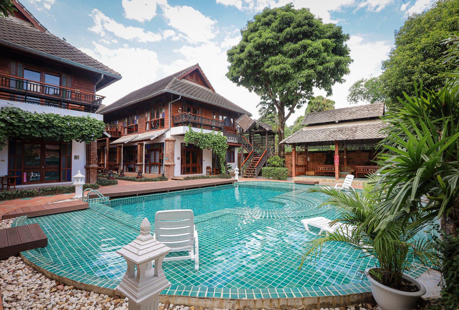The pool and teak buildings around the courtyard at Jintara Rehab in Chiang Mai